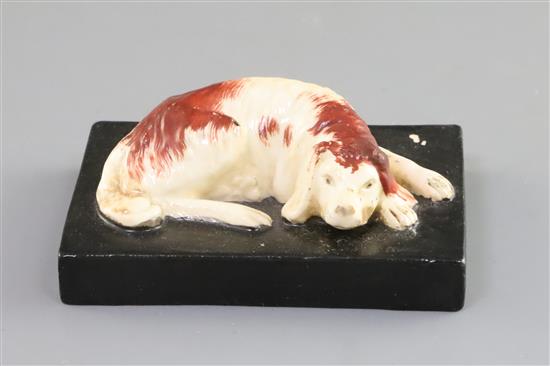 A Derby porcelain figure of a recumbent cocker spaniel, c.1820-45, L. 9cm